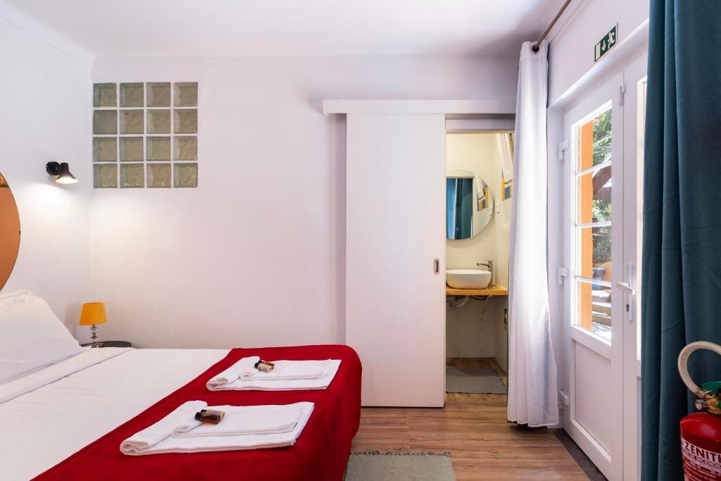 Quarto com acesso a casa de banho privativa